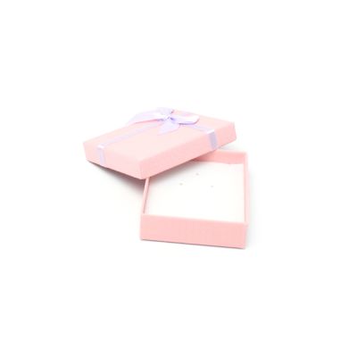 8x7x2cm. Pink gift box with lilac bow.